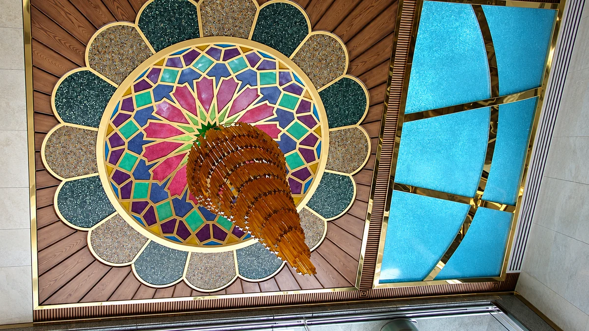 Stained glass ceiling rosette with a spiral amber crystal chandelier