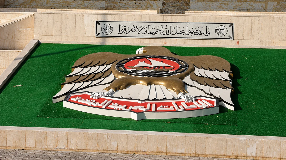 Monumental cast bronze UAE national emblem installed on a stone plinth